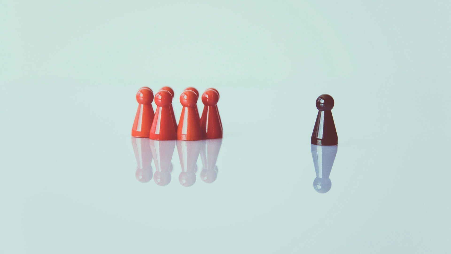 Group of Red Pawns with One Black Pawn